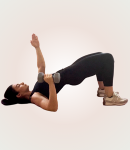 Single arm press in bridge position from Core Moms pre pregnancy workout